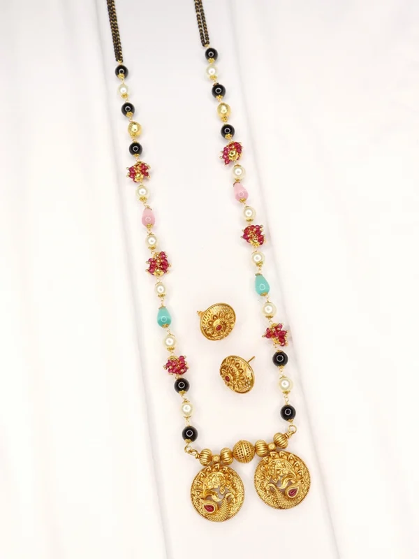 Base Metal: Brass, Beads, Kundan & Pearl Stone Plating: Micro Gold Plated with Matte finish Stone Type: Artificial Stones Sizing: 36 in long Type: Fancy Mangalsutra with Earrings As Per Image Free Shipping In Maharashtra Delivery time: 3 to 4 Working Day’s