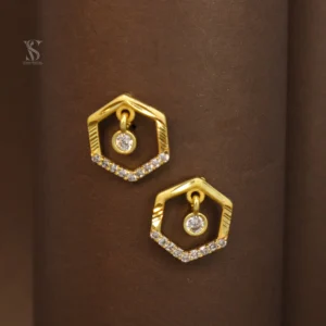 Presenting charming hexagonal-shaped gold plated stud earrings adorned with white stones! These earrings are specially designed for your modern and unique look. The gold plated frame in a hexagonal shape and the sparkling white stones set on the lower side give these earrings a special and attractive look. Also, a small dangling white stone in the center further enhances their beauty. These earrings are made from high-quality material and have a beautiful gold plating, making them look extremely attractive and premium. The stud design makes them easy and comfortable to wear. The special thing about these earrings is their unique hexagonal design and the shine of the white stones, which will give you a distinct and stylish look for any special occasion or everyday wear. They add to your beauty and give you a confident personality. Key Features: Unique Hexagonal Design: Attractive and distinct look. Sparkling White Stones: Beautiful and charming shine. Gold Plated: Beautiful and durable golden shine. Stud Design: Easy and comfortable to wear. High-Quality Material: Durable and safe. Suitable for Everyday and Special Occasions: Excellent choice for any time. Excellent Gift: A beautiful and stylish gift for your loved ones. Give a special touch to your beauty with these attractive hexagonal design white stone gold plated stud earrings!